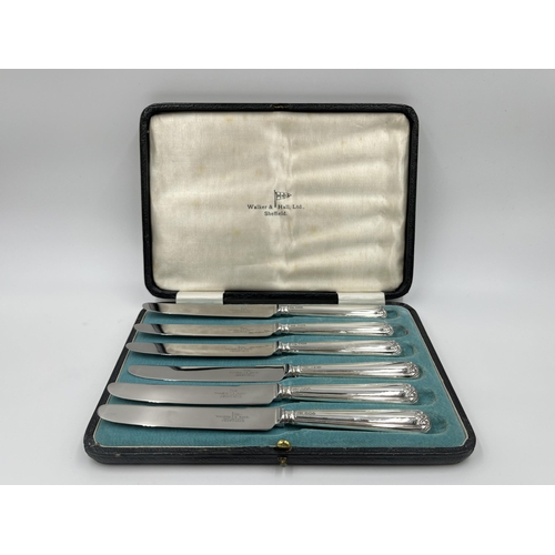 1242 - A cased set of six Walker & Hall hallmarked Sheffield silver handled knives, dated 1932