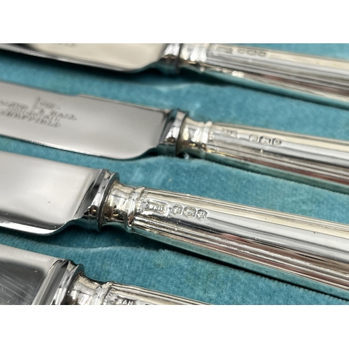 1242 - A cased set of six Walker & Hall hallmarked Sheffield silver handled knives, dated 1932