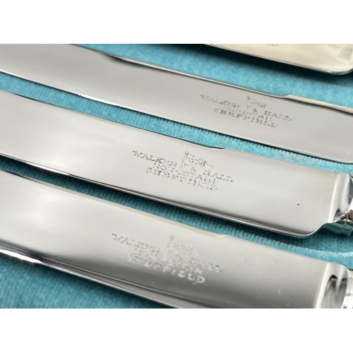 1242 - A cased set of six Walker & Hall hallmarked Sheffield silver handled knives, dated 1932