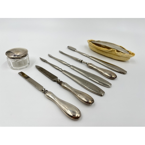 1244 - A cased R U & Co Ltd hallmarked Birmingham silver five piece manicure set and three further unmarked... 