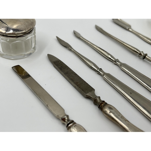 1244 - A cased R U & Co Ltd hallmarked Birmingham silver five piece manicure set and three further unmarked... 