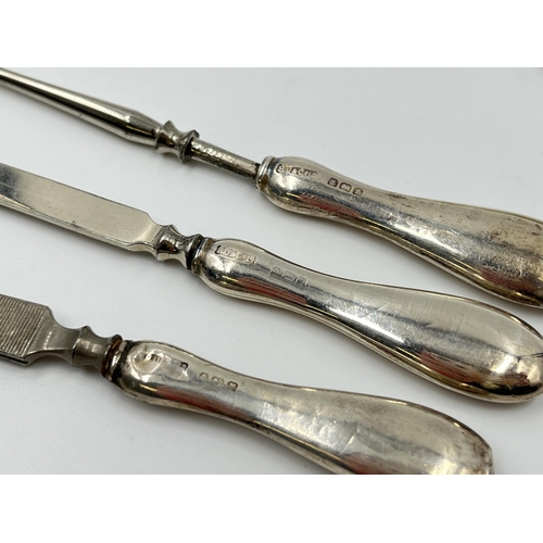 1244 - A cased R U & Co Ltd hallmarked Birmingham silver five piece manicure set and three further unmarked... 