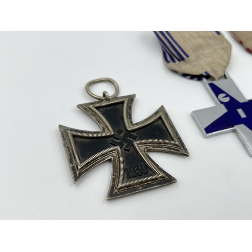 1263 - Four medals to include GIL crosses, German Iron Cross etc.