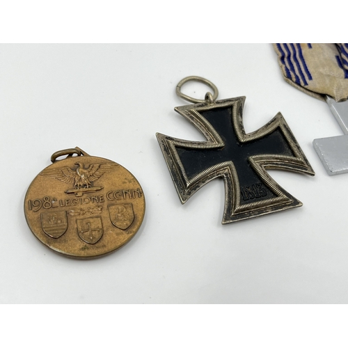 1263 - Four medals to include GIL crosses, German Iron Cross etc.