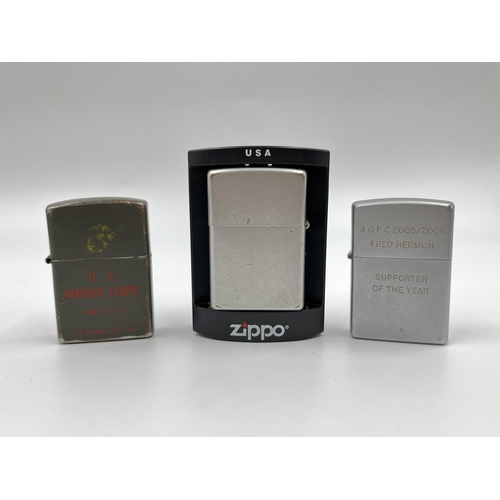 1265 - Three cigarette lighters, two Zippo and one U.S Marine Corps