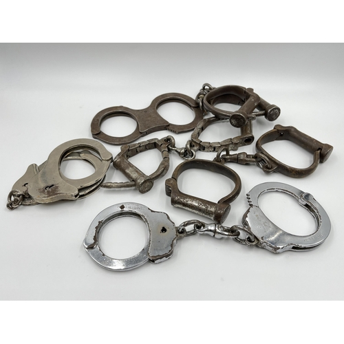 1267 - Six pairs of vintage handcuffs