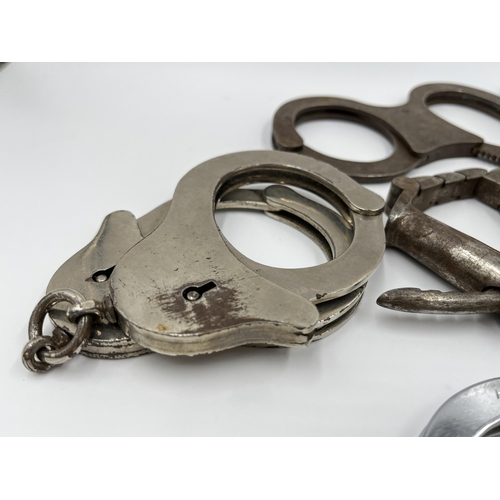 1267 - Six pairs of vintage handcuffs