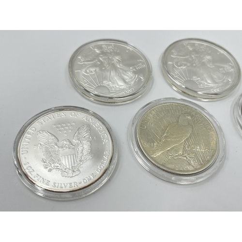 1281 - Five coins, three 2007 United States of America 1oz fine silver one dollars, one 1923 .900 silver Pe... 