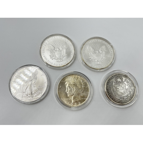 1281 - Five coins, three 2007 United States of America 1oz fine silver one dollars, one 1923 .900 silver Pe... 