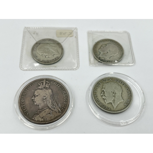 1292 - Four British coins, one 1889 Queen Victoria .925 silver crown, one 1920 George V half crown, one 192... 