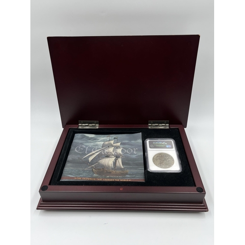 1299 - A boxed and sealed Carolus III (Charles III of Spain) eight reales .925 silver coin recovered from t... 