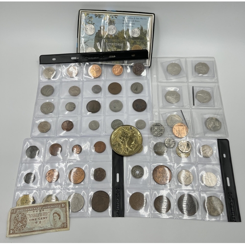 1300 - A collection of world wide coins to include six Elizabeth II Falkland Island penguin 50 pences, case... 