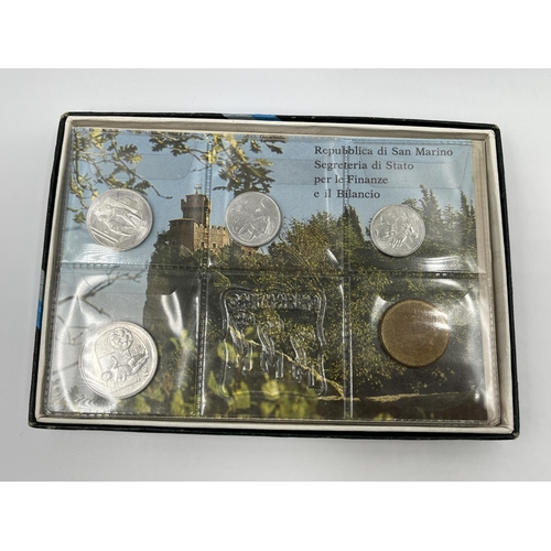 1300 - A collection of world wide coins to include six Elizabeth II Falkland Island penguin 50 pences, case... 