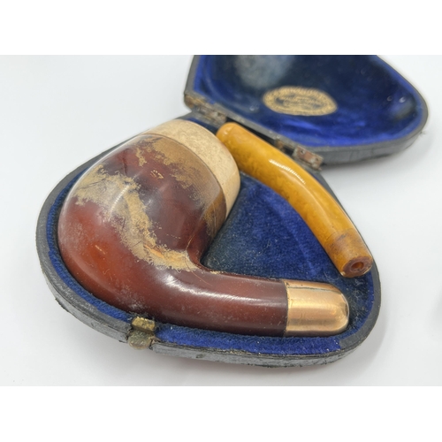 1304 - Two antique smoking pipes, one Karoo calabash pipe with hallmarked Birmingham silver collar and top ... 