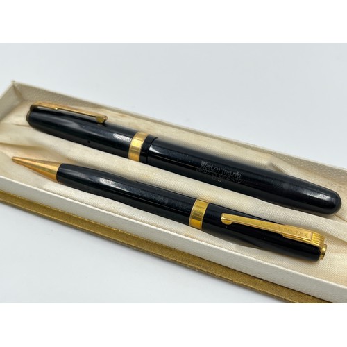 1305 - Two vintage boxed writing instrument sets, one Waterman's fountain pen with 14ct gold nib and propel... 