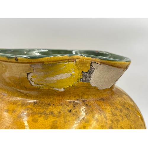 284D - An early 20th century C. H. Brannan yellow glazed jug - approx. 22cm high