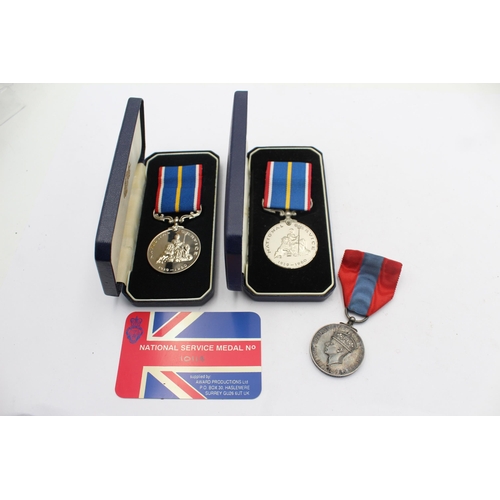 1143 - Three medals, two boxed National Service and one George VI Imperial Service presented to William Ope... 