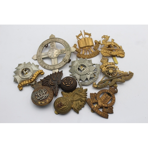 1154 - Ten military cap badges to include Bedfordshire, Army Educational Corps, Royal Berkshire etc.