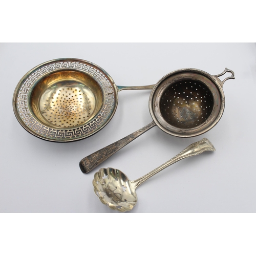 1199 - Three pieces of hallmarked sterling silver, two tea strainers and one sugar sifter - approx. gross w... 