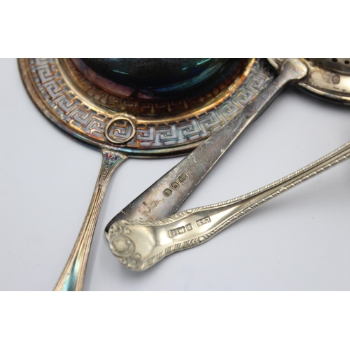 1199 - Three pieces of hallmarked sterling silver, two tea strainers and one sugar sifter - approx. gross w... 