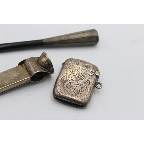 1207 - Three pieces of hallmarked sterling silver, one cigar cutter, one cheroot holder and one vesta case ... 