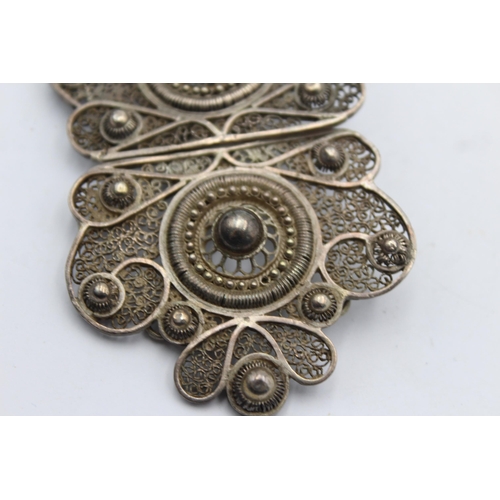 1209 - An antique sterling silver women's filigree belt buckle - approx. gross weight 39 grams and 10cm wid... 