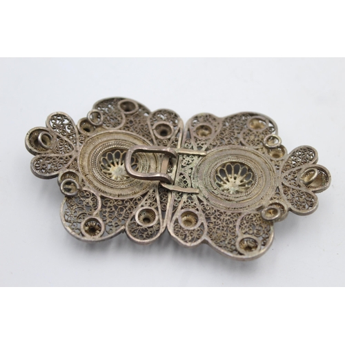 1209 - An antique sterling silver women's filigree belt buckle - approx. gross weight 39 grams and 10cm wid... 