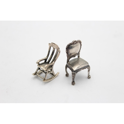 1213 - Two vintage hallmarked silver miniature doll's house chairs, one .800 and one .950 - approx. gross w... 