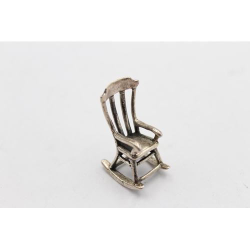 1213 - Two vintage hallmarked silver miniature doll's house chairs, one .800 and one .950 - approx. gross w... 