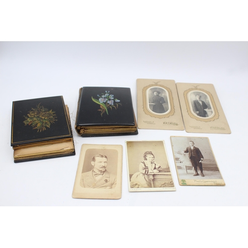 1222 - Two Victorian lacquered photo albums containing photographs