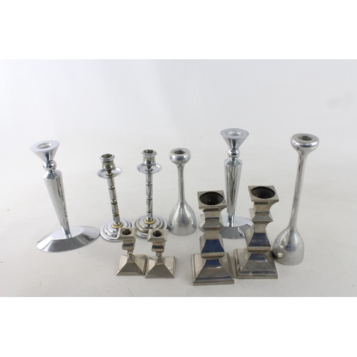 291 - Ten white metal candlesticks