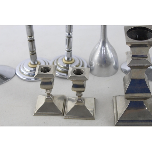 291 - Ten white metal candlesticks