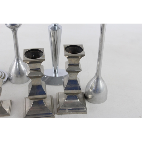 291 - Ten white metal candlesticks