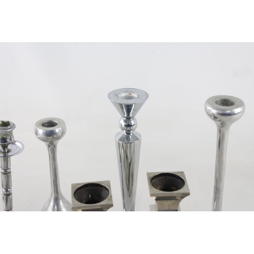 291 - Ten white metal candlesticks