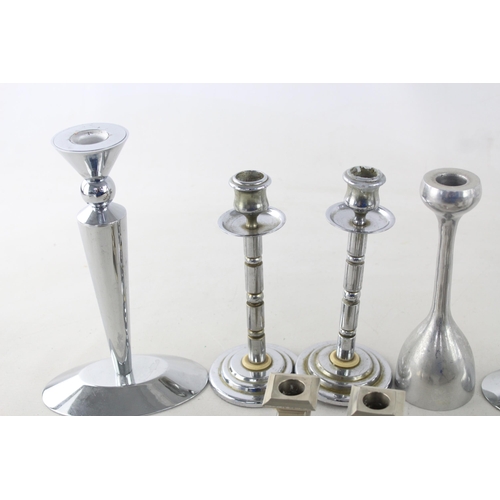 291 - Ten white metal candlesticks