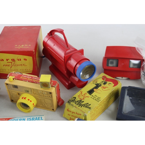 330 - A large collection of vintage view finders to include Fisher-Price, Argus Pre-Viewer etc.