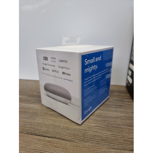 560 - Two items, one sealed Google Home Mini smart speaker and one Phillips Hue white light-automation sta... 