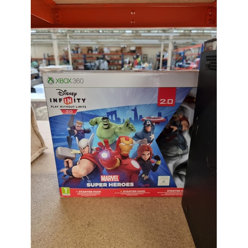 573 - A Microsoft Xbox 360 120GB Elite games console with boxed Disney Infinity and Skylanders game