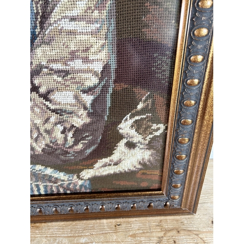 176 - A framed tapestry of a lady sewing - approx. 80cm high x 60cm wide