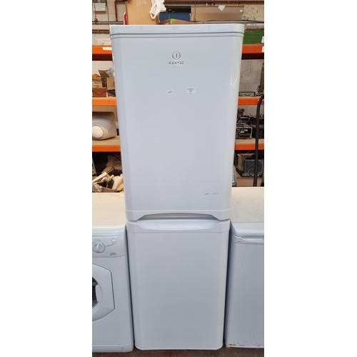 678 - An Indesit fridge freezer - approx. 54cm wide x 172cm high