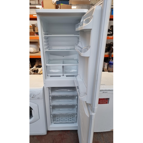 678 - An Indesit fridge freezer - approx. 54cm wide x 172cm high