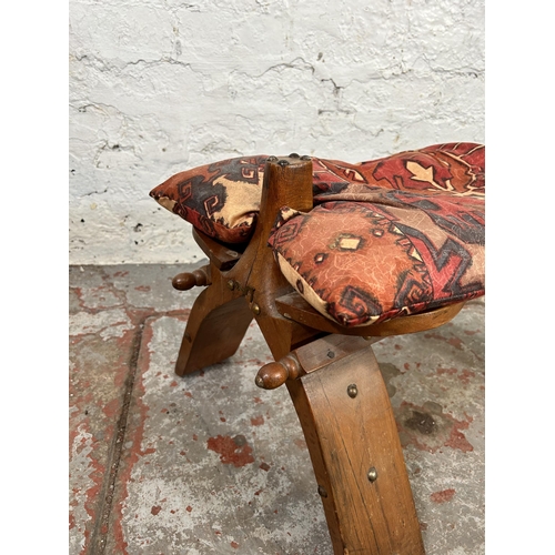 108 - A mid/late 20th century hardwood camel stool with cushion - approx. 39cm high x 40cm wide x 65cm lon... 