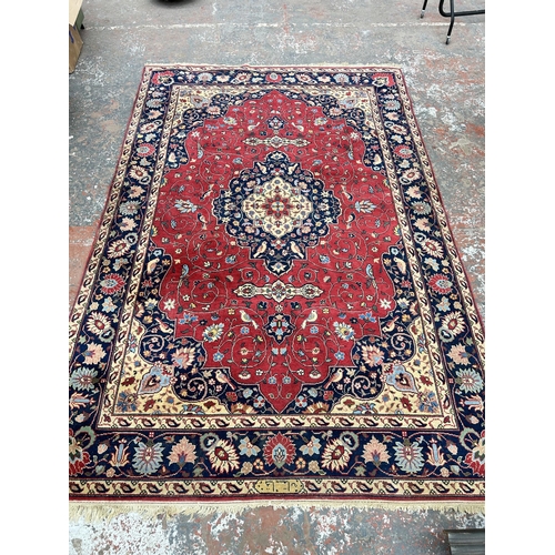 78 - A mid 20th century Persian style rug - approx. 310cm x 205cm