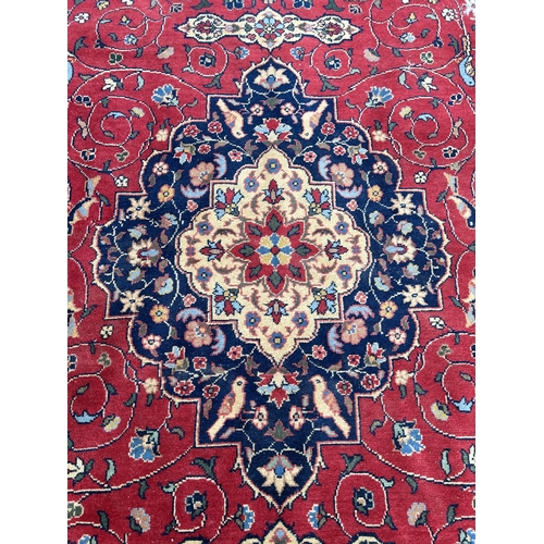 78 - A mid 20th century Persian style rug - approx. 310cm x 205cm