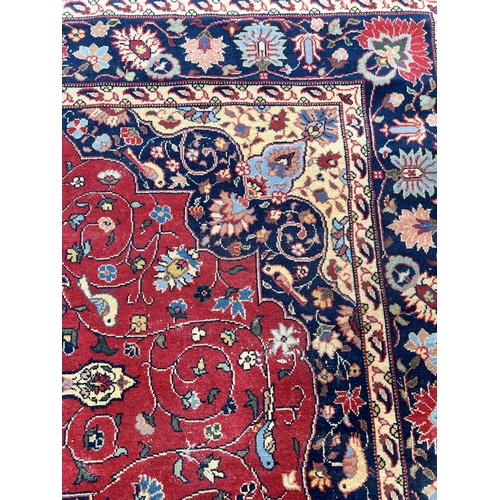 78 - A mid 20th century Persian style rug - approx. 310cm x 205cm