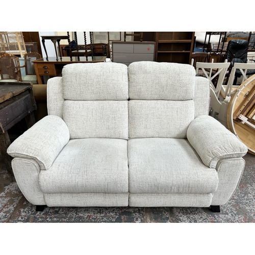 82 - A La-Z-Boy white fabric upholstered two seater sofa with black painted splayed supports - approx. 10... 