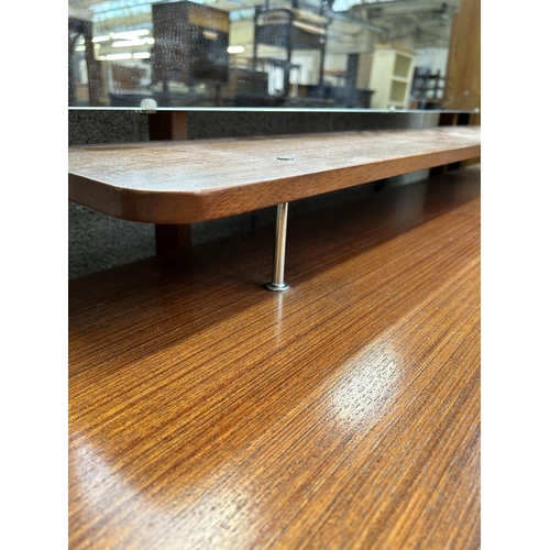 20 - A mid 20th century teak dressing table with six drawers and upper mirror - approx.