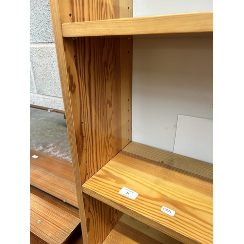 21 - A modern pine effect five tier free standing open bookcase - approx. 177cm high x 75cm wide x 24cm d... 