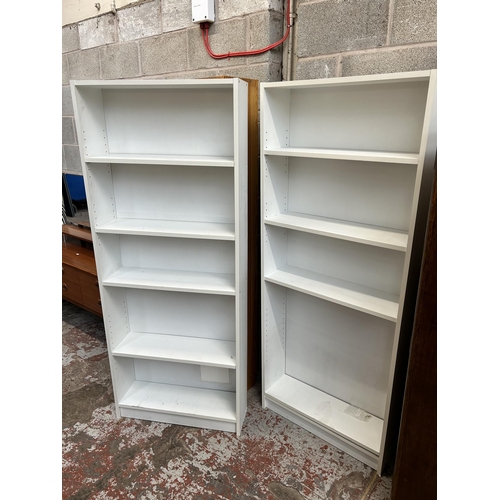 22 - Two modern white laminate free standing open bookcases - approx. 173cm high x 71cm wide x 21cm deep