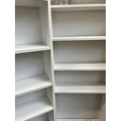 22 - Two modern white laminate free standing open bookcases - approx. 173cm high x 71cm wide x 21cm deep